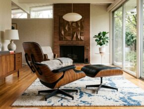 Iconic Eames Lounge Chair or Saarinen Tulip table with slender tapered legs, clean upholstery, and exposed wood grains in a mid-century modern interior.