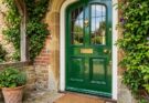 A glossy navy blue front door as a vibrant focal point on a home's exterior.