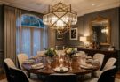 A stunning, large geometric or crystal chandelier as the focal point in a sophisticated dining room