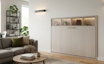 Closed fold-down wall desk with whitewashed oak finish, blending into a modern living room as a decorative panel.