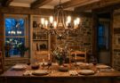 Rustic farmhouse dining room with vintage chandelier and Edison bulbs, casting a soft, ambient glow.