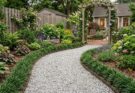 Meandering pea gravel path with steel edging and mondo grass