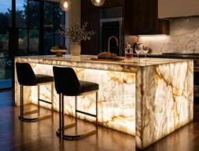 Show-stopping kitchen island made of translucent, backlit onyx or quartzite, glowing with natural patterns.
