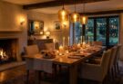 Cozy dining room with layered lighting, dimmable pendants, sconces, and candles for an inviting atmosphere.