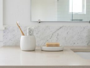 Decluttered bathroom countertop with minimal, organized essentials for a spa-like feel.