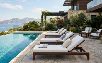 Premium poolside furniture made from teak and powder-coated aluminum with plush, quick-drying cushions for a resort feel.