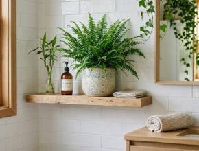 Bathroom featuring a vibrant green fern plant and natural wood accents, bringing nature indoors.
