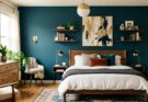 Bedroom featuring a bold accent wall painted in deep teal, making a strong design statement.
