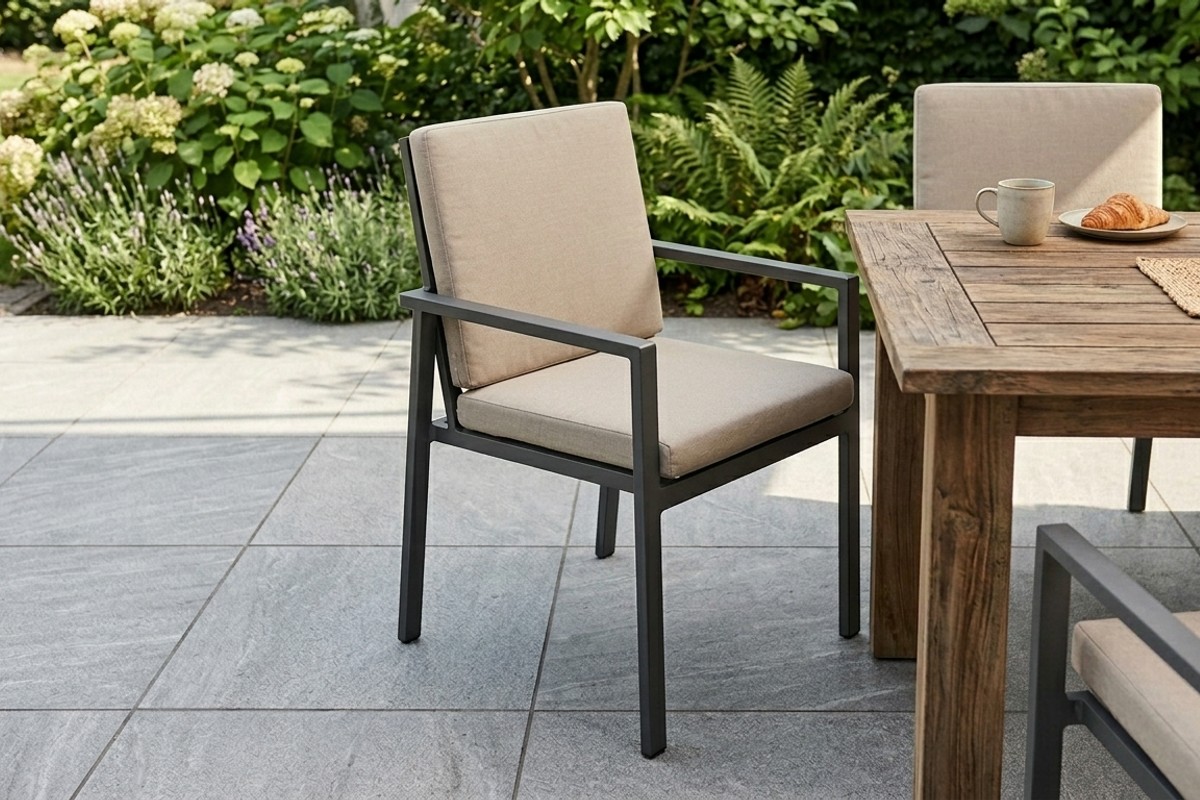 Patio furniture made of durable powder-coated aluminum and teak, with porcelain paver flooring.